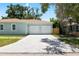 Spacious two-car garage offers ample parking and enhances this home's functional appeal with a long driveway at 1301 12Th S St, St Petersburg, FL 33705