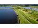 Aerial view of lakes, green fields, and interconnected waterways at 1471 Arcadia Ave, Sarasota, FL 34232