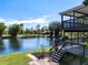 Beautiful backyard with tiered decks overlooking a tranquil lake, ideal for outdoor living at 1471 Arcadia Ave, Sarasota, FL 34232