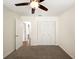 Neat bedroom featuring closet, ceiling fan, and carpet floors at 1471 Arcadia Ave, Sarasota, FL 34232