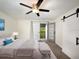 Bedroom featuring a comfortable bed, ample natural light, access to a balcony, and barn door closet at 1471 Arcadia Ave, Sarasota, FL 34232