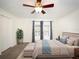 Bedroom with a serene ambiance, featuring a comfortable bed, ample natural light, and closet at 1471 Arcadia Ave, Sarasota, FL 34232