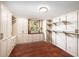 Custom closet with ample storage, built-in shelves, drawers, and a view to the outdoors at 1471 Arcadia Ave, Sarasota, FL 34232