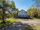 Exterior of home with large deck space overlooking the pond and manicured lawn at 1471 Arcadia Ave, Sarasota, FL 34232