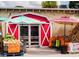 A roadside farm stand with fresh cantaloupe, pumpkins, and other produce displayed at 1471 Arcadia Ave, Sarasota, FL 34232