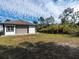 View of the garage and partial view of the spacious backyard at 1471 Arcadia Ave, Sarasota, FL 34232