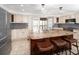 Spacious kitchen features an island with seating, plenty of cabinet space, and stainless steel appliances at 1471 Arcadia Ave, Sarasota, FL 34232