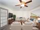 Bright living room featuring neutral walls, plush seating, and a view of the outdoors at 1471 Arcadia Ave, Sarasota, FL 34232