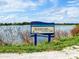 Ackerman Park sign with a view of the lake at 1471 Arcadia Ave, Sarasota, FL 34232
