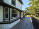 Long porch with a bench facing the yard at 1471 Arcadia Ave, Sarasota, FL 34232