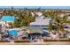 Aerial view of waterfront restaurant with outdoor seating and vibrant coastal atmosphere at 15 Seaside Ct, Holmes Beach, FL 34217