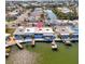 Aerial view of the property highlighting its waterfront location and private dock at 15 Seaside Ct, Holmes Beach, FL 34217