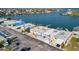 Aerial view of a waterfront home with private boat dock and lift, in a beautiful waterfront neighborhood at 15 Seaside Ct, Holmes Beach, FL 34217
