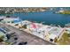 Aerial shot showcasing waterfront home, boating access, and the surrounding community at 15 Seaside Ct, Holmes Beach, FL 34217