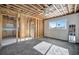 Unfinished bedroom featuring open ceiling with ceiling fan, a window and natural light at 15 Seaside Ct, Holmes Beach, FL 34217