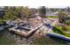 Aerial view of a boat dock showing repair work with wooden planks, concrete base and access to the water for boating at 15 Seaside Ct, Holmes Beach, FL 34217