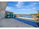 Beautiful water view from the dock, showcasing kayaks and waterfront living at 15 Seaside Ct, Holmes Beach, FL 34217