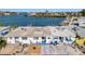 Waterfront home with boat dock on a sunny day, perfect for boating and enjoying the waterfront lifestyle at 15 Seaside Ct, Holmes Beach, FL 34217
