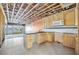Spacious kitchen area featuring wooden cabinets, a tile backsplash, granite counters, and a large island at 15 Seaside Ct, Holmes Beach, FL 34217