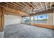 Living area with tile floors and windows overlooking the water, presenting an opportunity for renovation and customization at 15 Seaside Ct, Holmes Beach, FL 34217