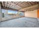 Unfinished living room with large windows and water views at 15 Seaside Ct, Holmes Beach, FL 34217