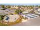 Aerial view of a skate park featuring concrete bowls, ramps, and street elements in a vibrant, community-focused area at 15 Seaside Ct, Holmes Beach, FL 34217