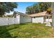 Lush backyard featuring green grass and a white privacy fence at 1739 16Th S Ave, St Petersburg, FL 33712
