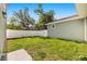 Backyard featuring green grass and a white privacy fence at 1739 16Th S Ave, St Petersburg, FL 33712
