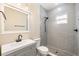 Modern bathroom with gray tiled shower, matte black hardware, and a sleek vanity at 1739 16Th S Ave, St Petersburg, FL 33712