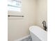 Bright bathroom featuring a modern soaking tub, stylish tile floor, and a sleek black towel rack at 1739 16Th S Ave, St Petersburg, FL 33712