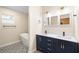Elegant bathroom featuring double vanity, modern fixtures, tub, and decorative tile floor at 1739 16Th S Ave, St Petersburg, FL 33712