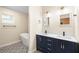 Elegant bathroom featuring double vanity, modern fixtures, tub, and decorative tile floor at 1739 16Th S Ave, St Petersburg, FL 33712