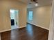 Spacious bedroom with a ceiling fan and ensuite bathroom featuring patterned tile floor at 1739 16Th S Ave, St Petersburg, FL 33712