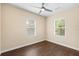 Bright bedroom with wood floors and a ceiling fan and two windows at 1739 16Th S Ave, St Petersburg, FL 33712