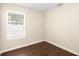 Bedroom features wood-look floors, light walls, and a window with blinds at 1739 16Th S Ave, St Petersburg, FL 33712