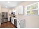 Modern kitchen features stainless steel appliances, quartz countertops, and ample cabinet space at 1739 16Th S Ave, St Petersburg, FL 33712