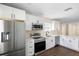 Beautiful kitchen featuring white cabinets, stainless steel appliances, and sleek countertops at 1739 16Th S Ave, St Petersburg, FL 33712