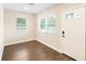 Bright living room featuring hardwood floors, neutral walls, and abundant natural light through windows at 1739 16Th S Ave, St Petersburg, FL 33712