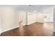 Open living area featuring wood floors, light walls, a decorative chandelier, and a sunny front door at 1739 16Th S Ave, St Petersburg, FL 33712