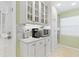 Bright kitchen detail showcasing white cabinetry, granite countertops, and modern appliances at 1870 Jasmine Dr, Sarasota, FL 34239