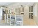 Bright kitchen featuring white cabinetry, stainless steel appliances, and counter seating at 1870 Jasmine Dr, Sarasota, FL 34239