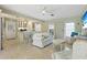 Inviting open-concept living room with terrazzo floors flowing into the kitchen and dining areas at 1870 Jasmine Dr, Sarasota, FL 34239