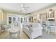 Bright, open living space with a seamless flow to kitchen and outdoor dining area at 1870 Jasmine Dr, Sarasota, FL 34239