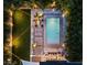 Inviting aerial view of backyard with a pool, lounge chairs, and beautiful landscaping at 2305 Pine Ter, Sarasota, FL 34231