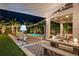 Exterior of home featuring a covered patio, artificial turf, and an inviting pool area at 2305 Pine Ter, Sarasota, FL 34231