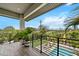 Balcony overlooking the pool with potted plants and patio furniture at 2305 Pine Ter, Sarasota, FL 34231