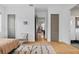 Bedroom with herringbone floors, a gray chair, and three doors at 2305 Pine Ter, Sarasota, FL 34231