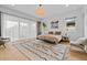 Bedroom with a large window, light fixture, and modern rug at 2305 Pine Ter, Sarasota, FL 34231