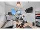 Bright and airy home gym with hardwood floors and equipped with modern fitness machines and equipment at 2305 Pine Ter, Sarasota, FL 34231