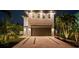 Modern two-story home featuring clean lines, a spacious driveway, and professional landscaping at 2305 Pine Ter, Sarasota, FL 34231
